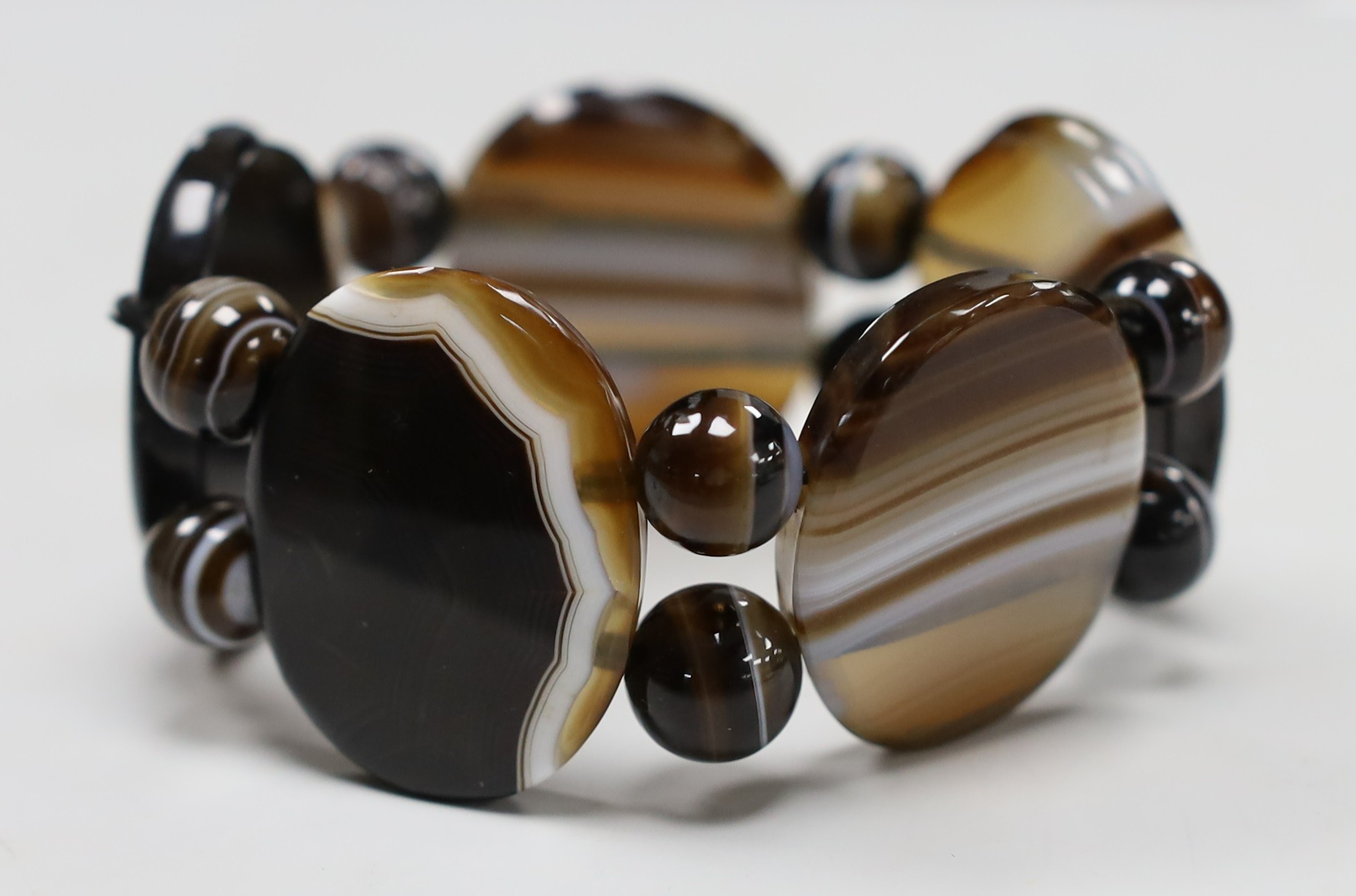 A banded agate oval link and bead bracelet.
